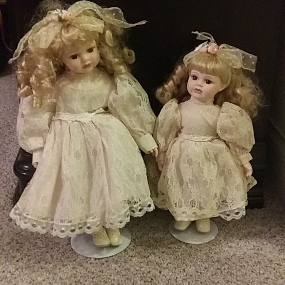 Porcelain dolls on stand.
